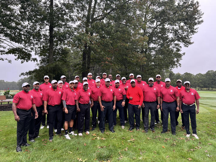 Kappa Alpha Psi team in red on the course