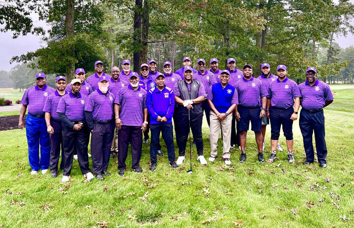 Omega Psi Phi team in purple on the course